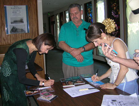 signing autographs